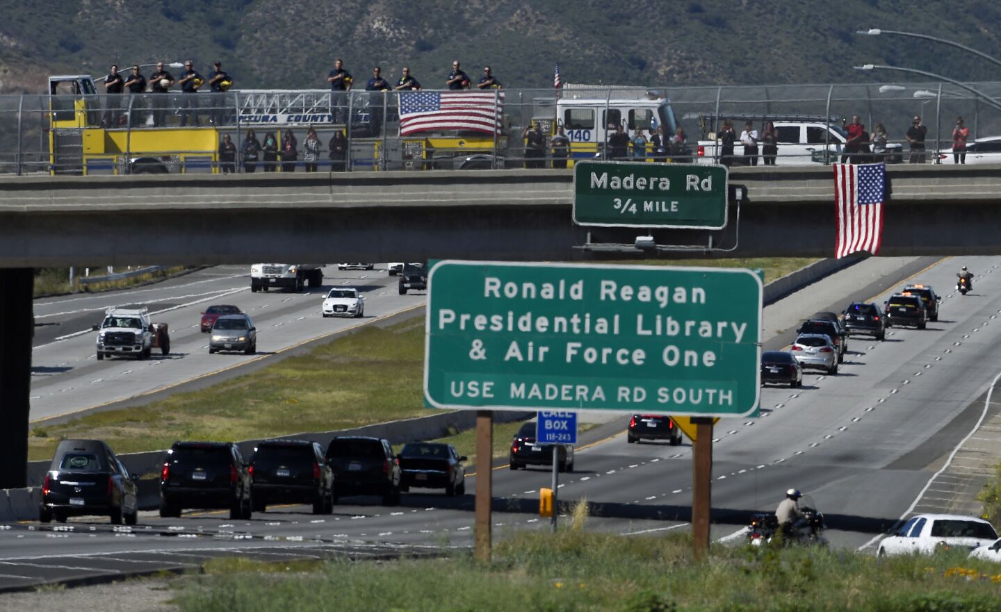 Firefighters salute as the hearse carrying the body of Nancy Reagan makes its way to the Ronald Reagan Presidential Library.