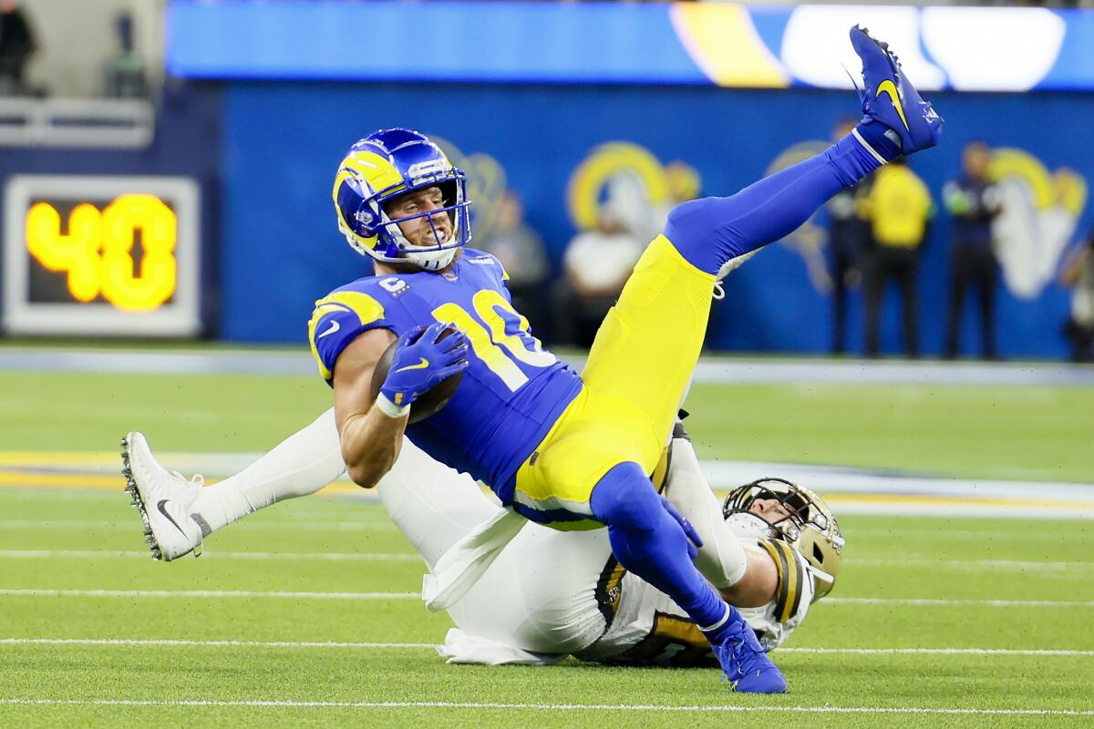Los Angles Rams wide receiver Cooper Krupp falls after making a catch