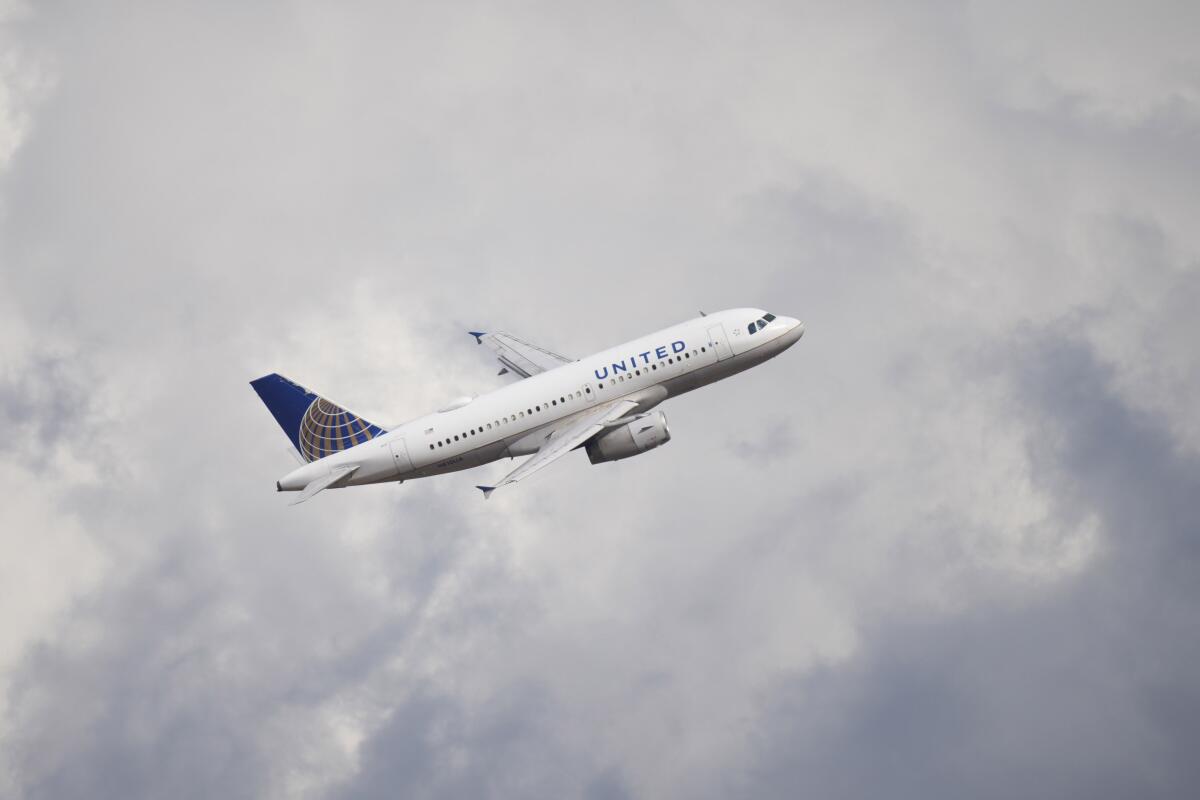 A United Airlines jetliner takes off from a runway at Denver International Airport in 2021. 