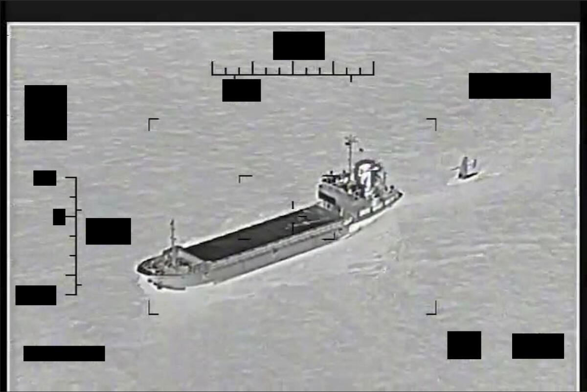 U.S. sea drone being towed by Iranian military ship