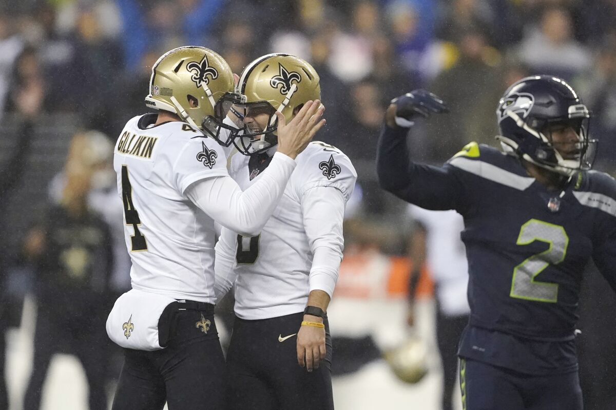 New Orleans Saints' Brian Johnson is congratulated by Blake Gillikin after kicking a 33-yard field goal.