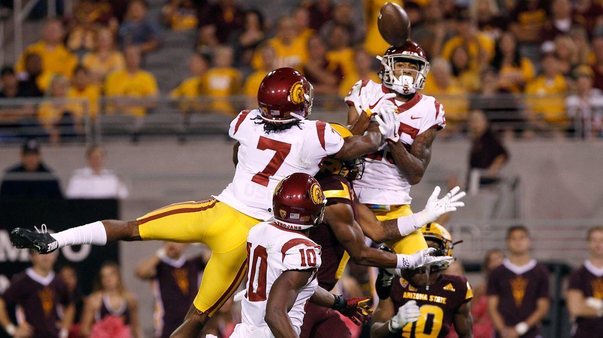 USC defensive backs Marvell Tell III (7) and Jack Jones and the Trojans' passing defense were up to the task last week against Harry N'Keal, center, and Arizona State. On Saturday, it's their run defense that figures to be tested.