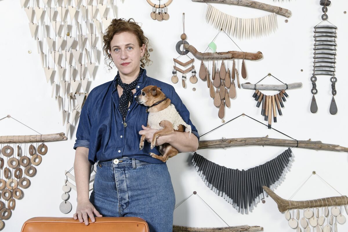 Ceramicist Heather Levine and her trusted shop dog, Pierre.