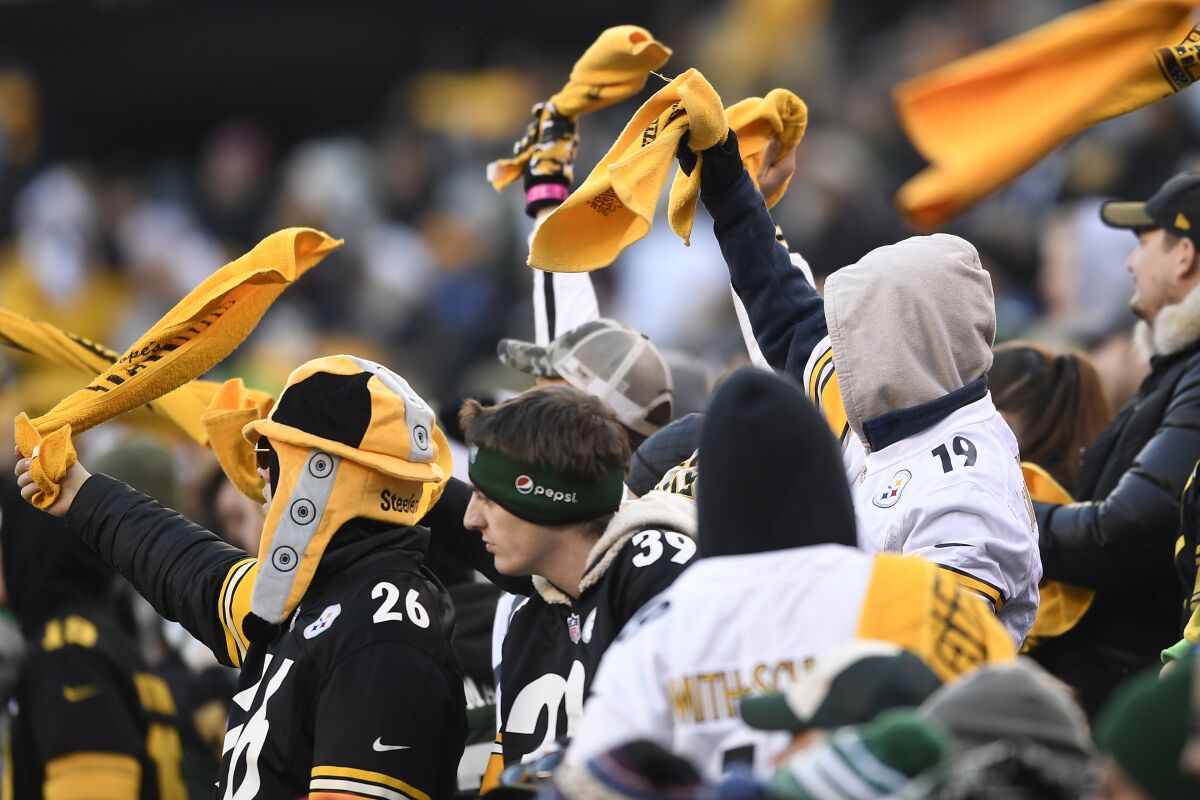 Pittsburgh Steelers fans wave Terrible Towels during the second half of a game against the New York Jets on Sunday at MetLife Stadium.