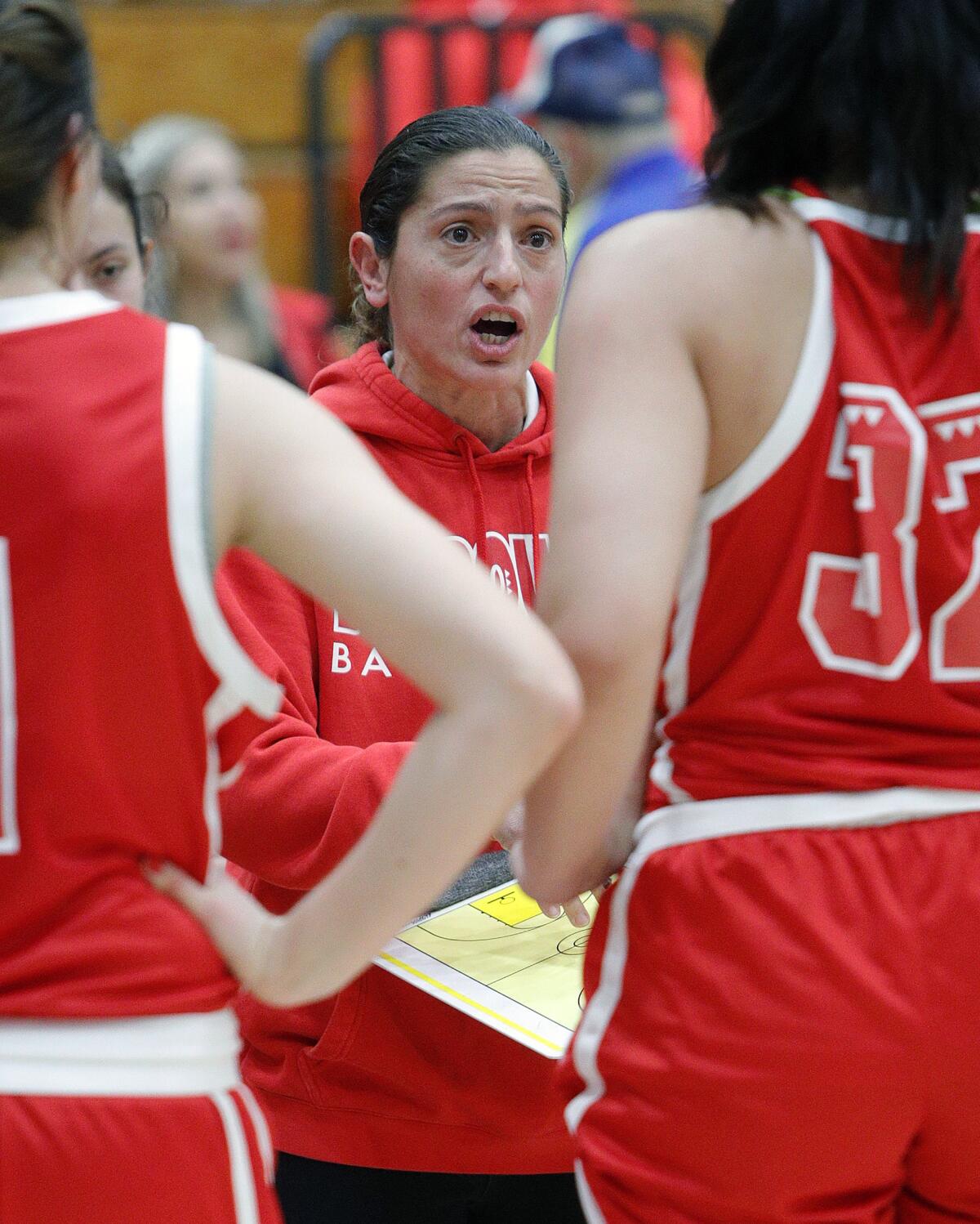 Burroughs High girls' basketball coach Vicky Oganyan and the Indians played against host Pasadena in a Pacific League game Friday.