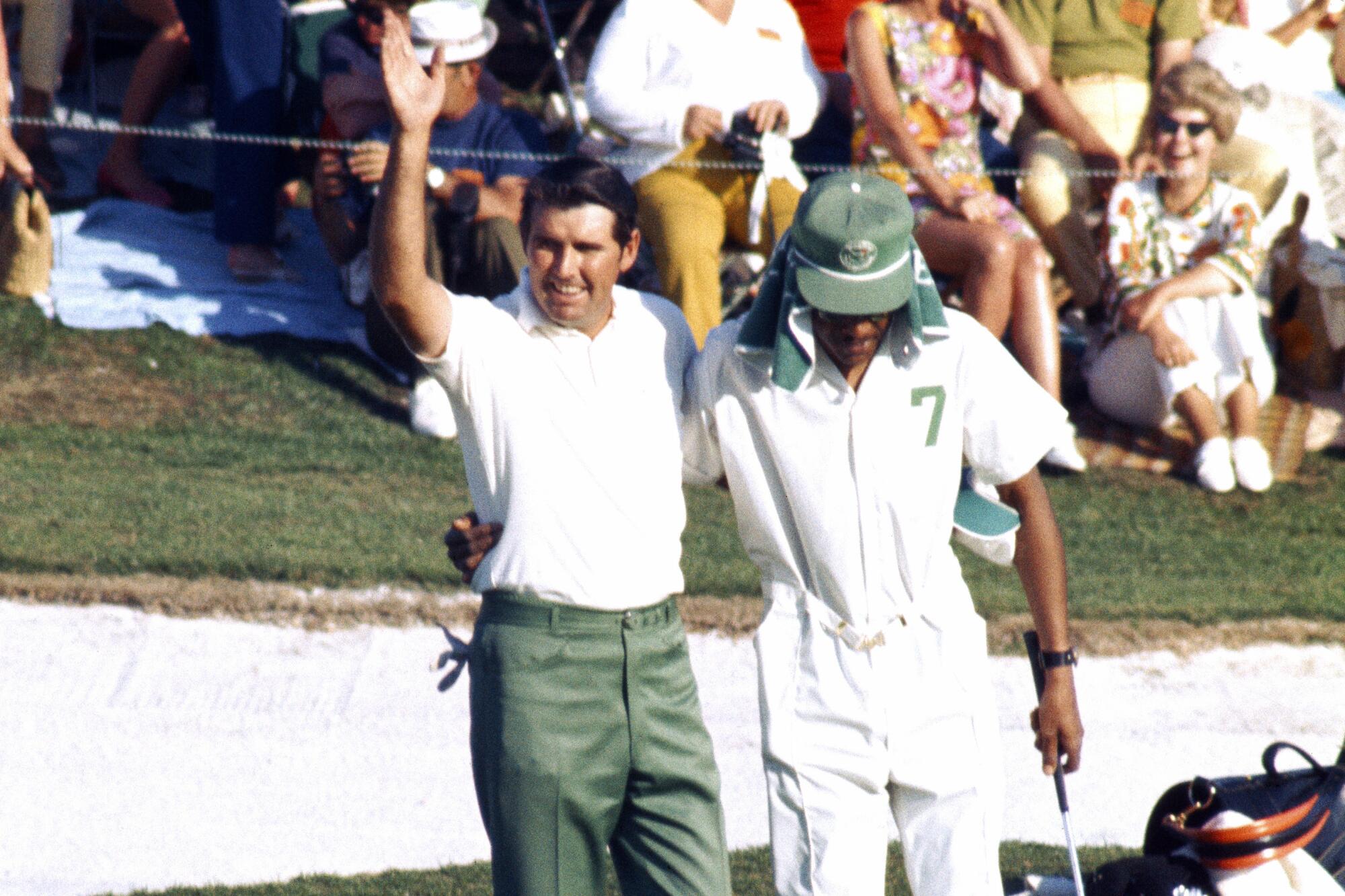  Charles Coody and caddie Walter Pritchett react to victory during the 1971 Masters.