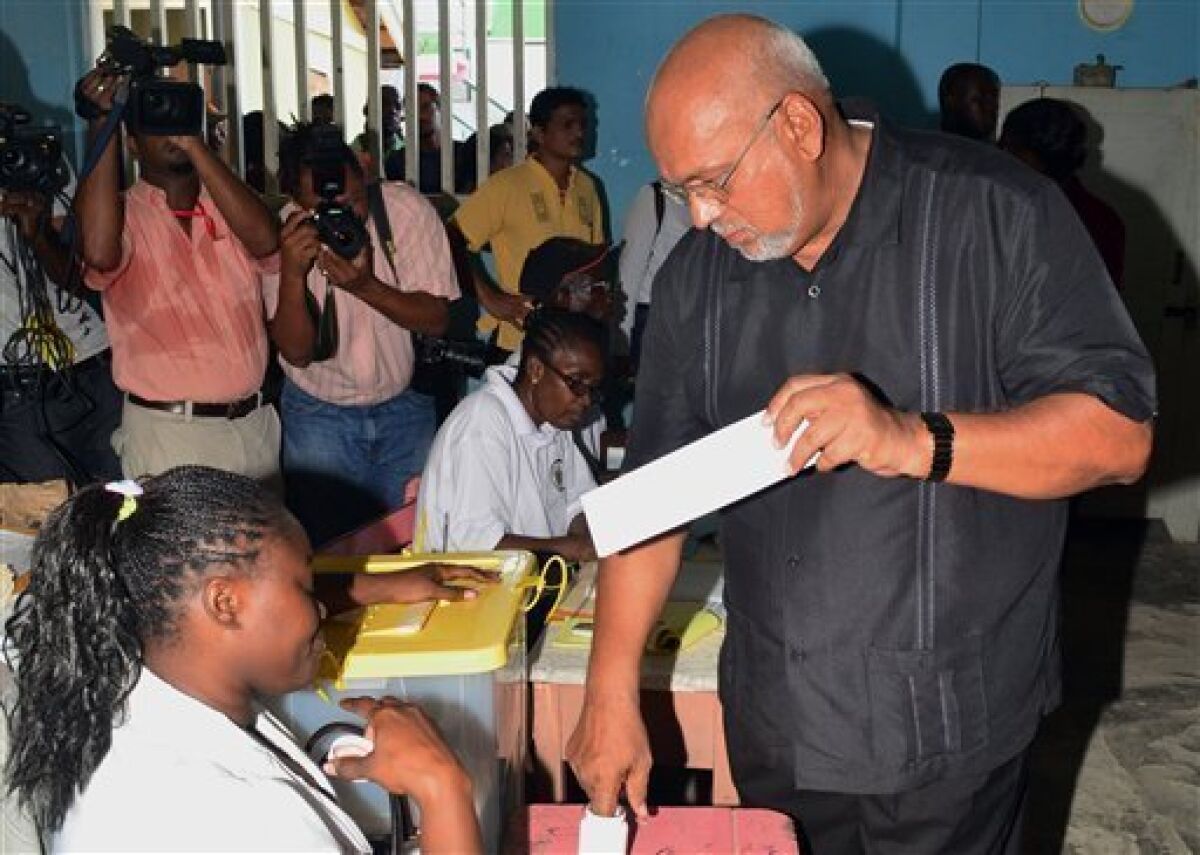 Donald Ramotar, presidential candidate of the ruling People's Progressive Party casts his ballot during presidential and parliamentary elections in Georgetown, Guyana, Monday Nov. 28, 2011. (AP Photo)