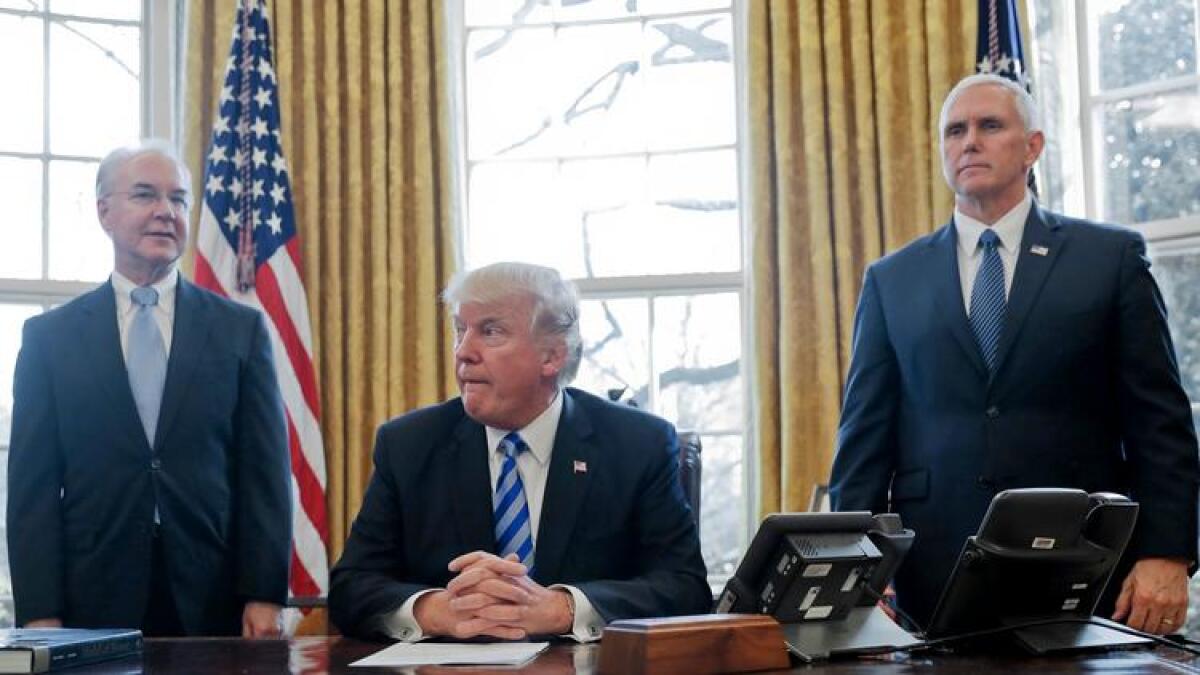 President Trump, flanked by Health and Human Services Secretary Tom Price, left, and Vice President Mike Pence, in March.