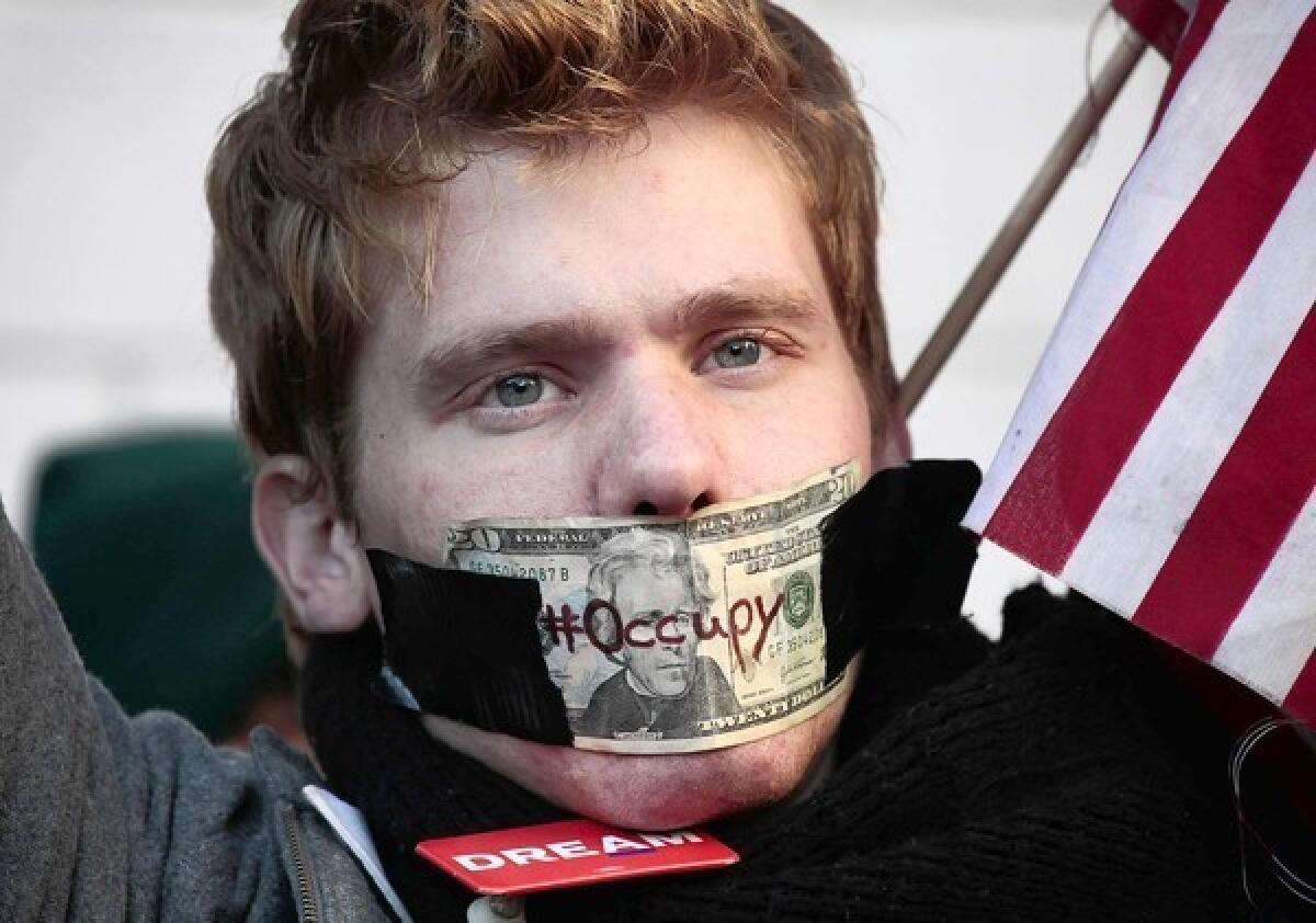 An Occupy Wall Street protester participates in a march on Oct. 25, 2011, to the foot of the Brooklyn Bridge.