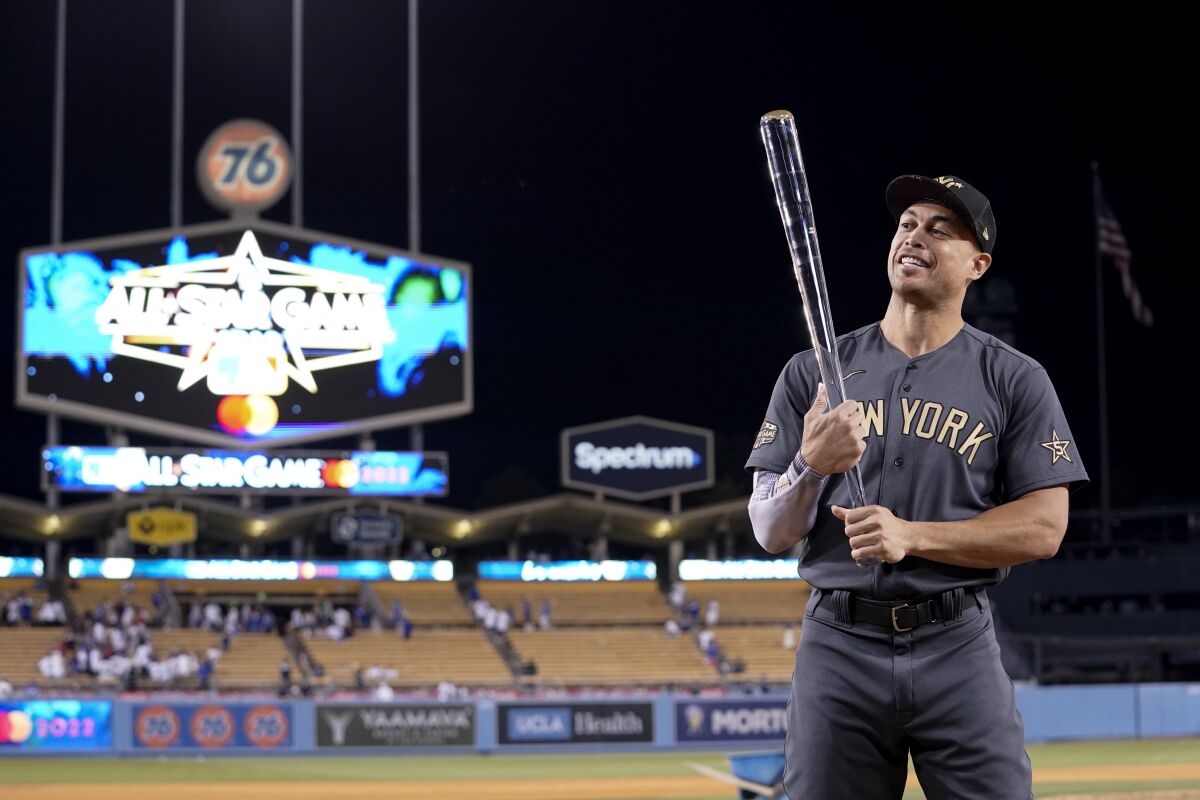 American League's Giancarlo Stanton, of the New York Yankees, poses with the Ted Williams Most Valuable Player trophy following the MLB All-Star baseball game against the National League, Tuesday, July 19, 2022, in Los Angeles. The American League won 3-2. (AP Photo/Mark J. Terrill)