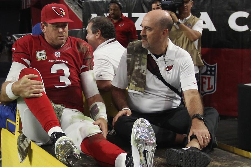 Arizona Cardinals quarterback Carson Palmer is carted off the field after suffering a left knee injury during Sunday's win over the St. Louis Rams