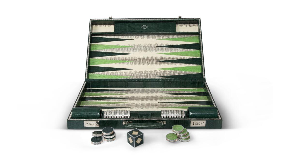 Geoffrey Parker watersnake backgammon set with Swarovski crystal detailing , $7,117 at Leclaireur in West Hollywood, leclaireurla.com.