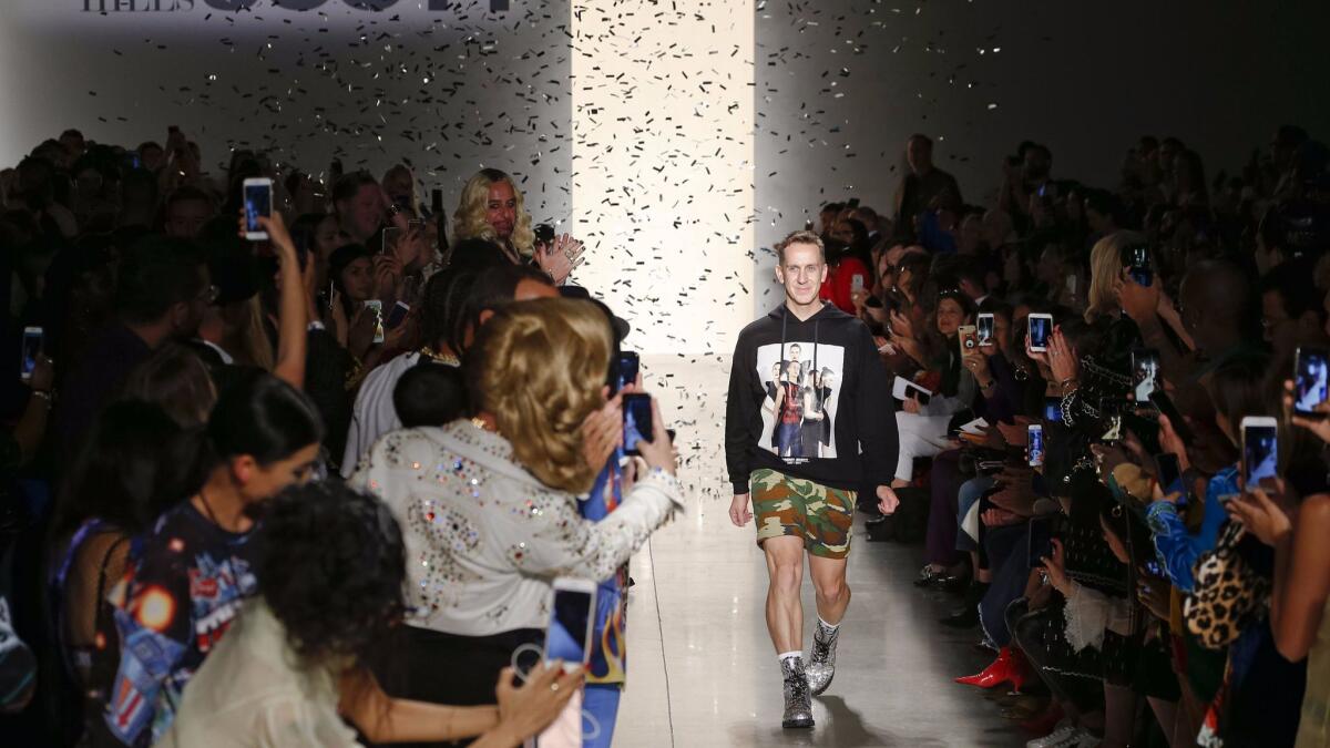 Designer Jeremy Scott is showered in confetti at the end of the runway show, which marked a 20th anniversary celebration of his namesake label.