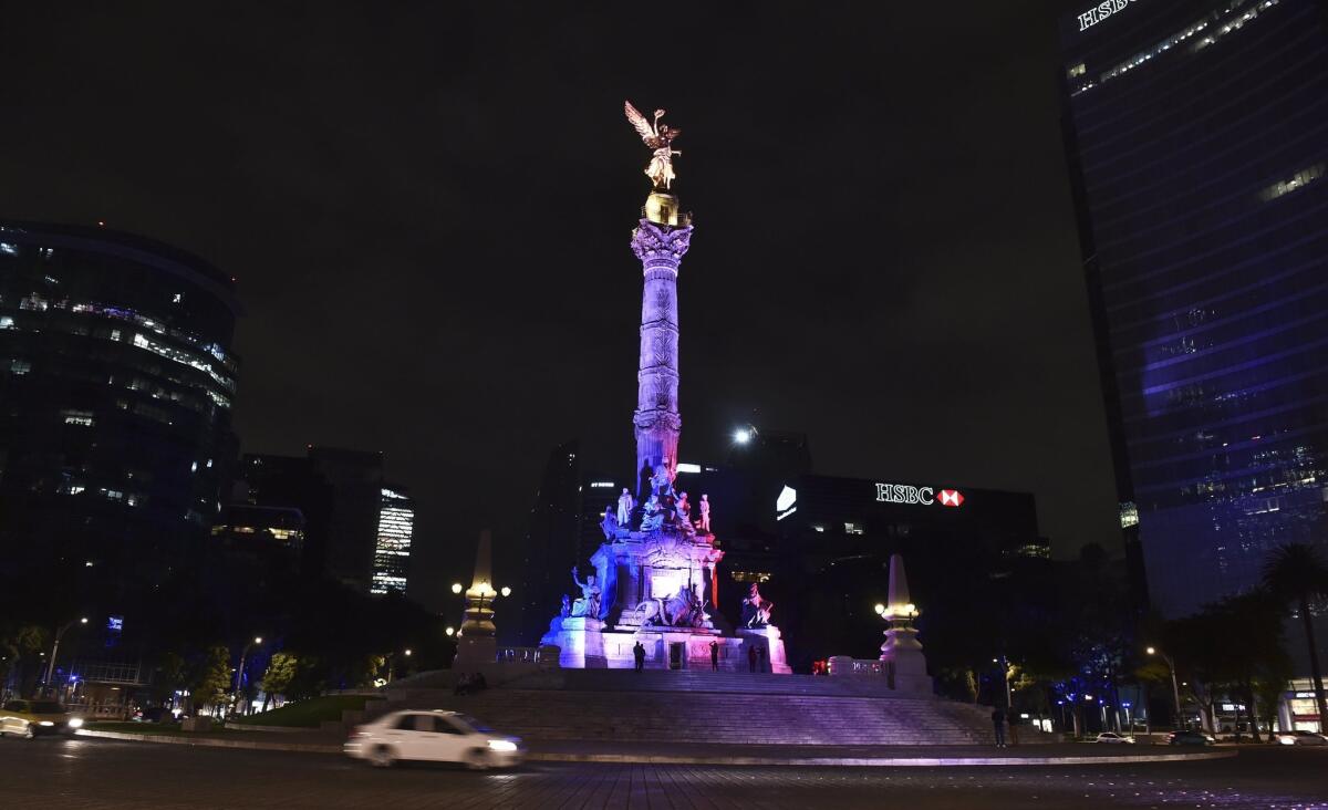Mexican Independence Angel square is illuminated with the red, white and blue colors of the French national flag in solidarity with France on Friday in Mexico City, after attackers killed at least 120 people in Paris.