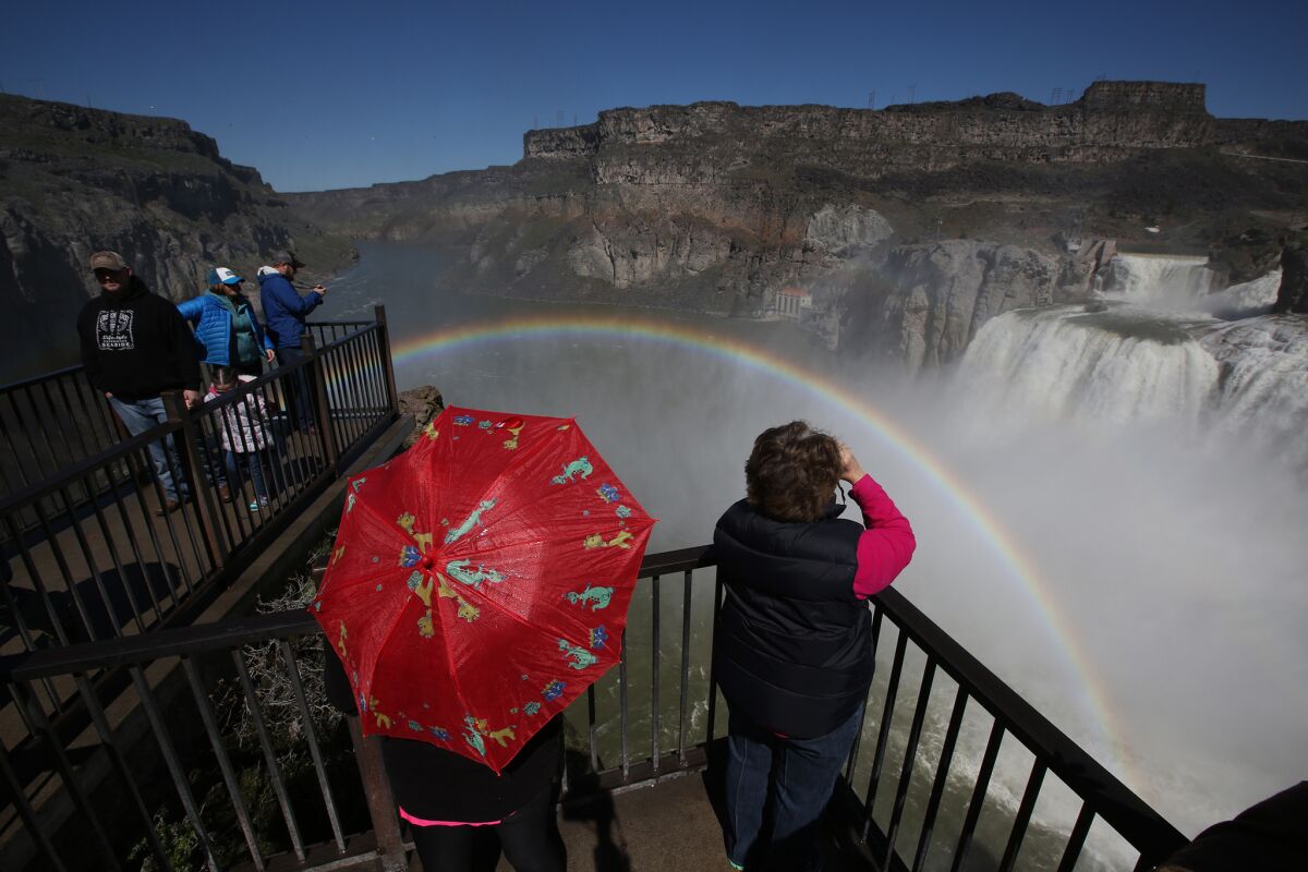 Visitors view a rainbow in the mist from Shoshone Falls on the Snake River. (Robert Gauthier / Los Angeles Times)