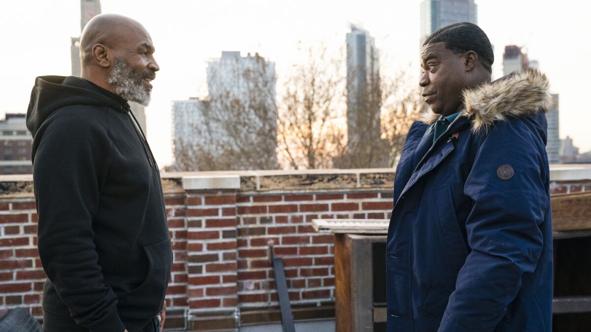 Guest star Mike Tyson, left, and Tracy Morgan in the season premiere of "The Last O.G." on TBS.