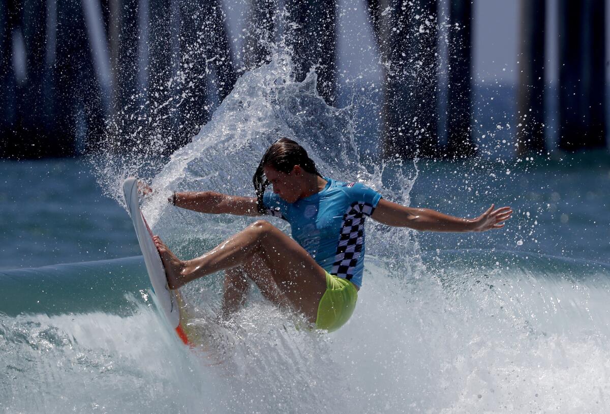 HUNTINGTON BEACH, CALIF. - AUG. 5, 2018. Courtney Conlogue competes in the women's semifinals of the 2018 Vans U.S, Open of Surfing on Sunday, Aug. 5, 2018, in Huntington Beach. (Luis Sinco/Los Angeles Times)