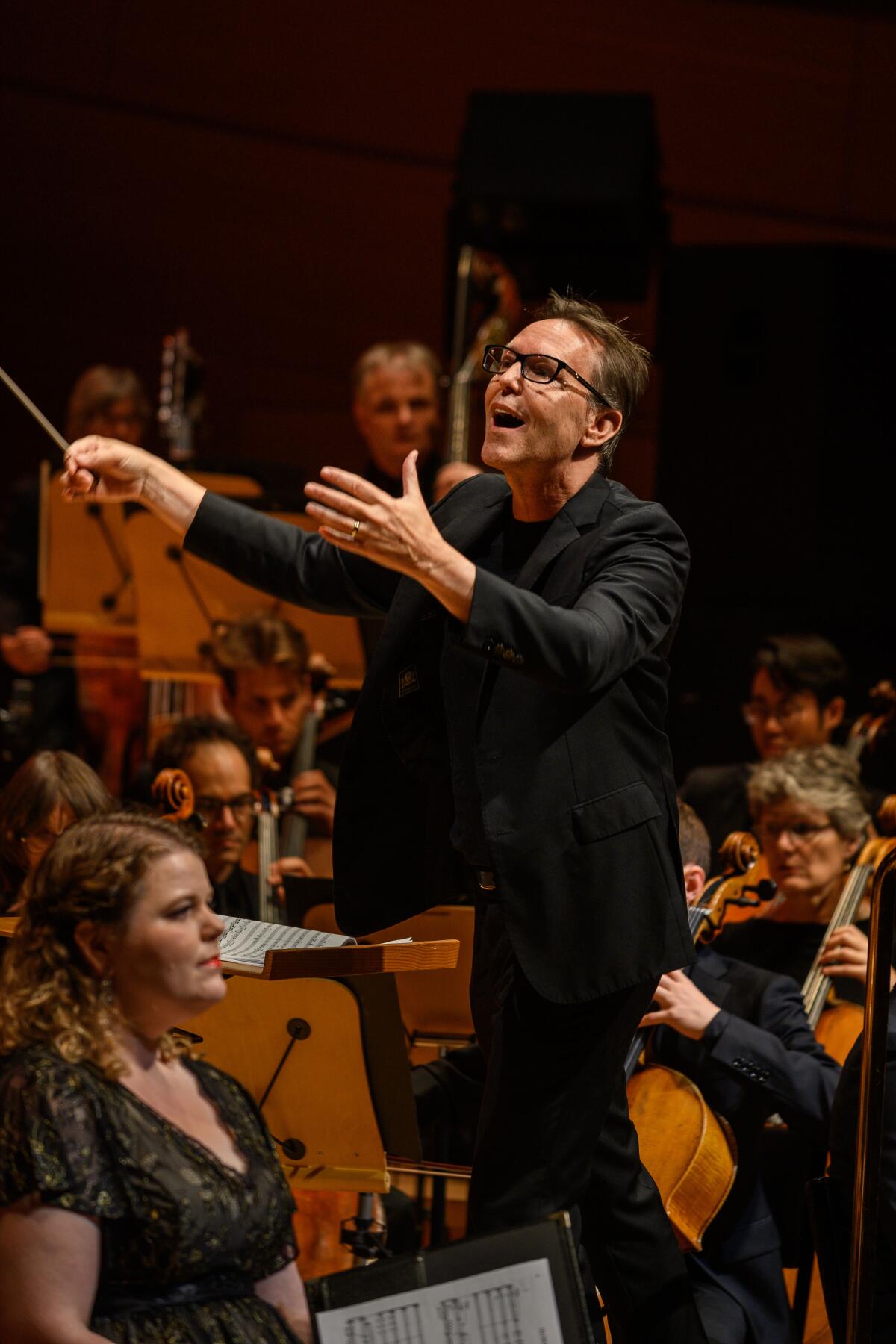 A man conducts a choir.