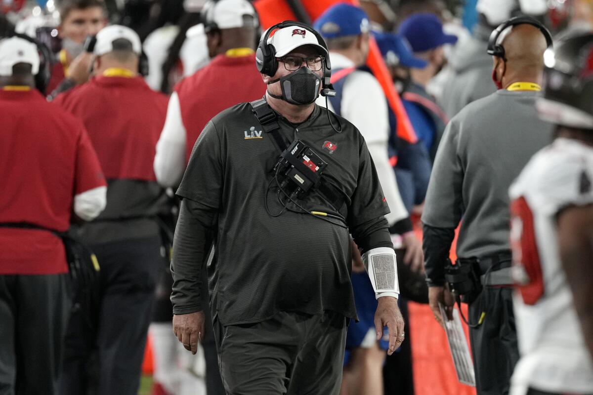 Tampa Bay Buccaneers head coach Bruce Arians walks on the sideline during the first half of Super Bowl LV.