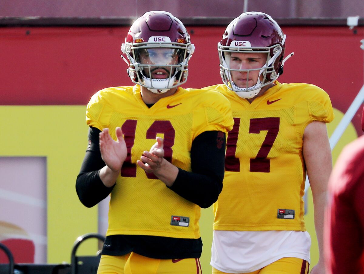 USC quarterbacks Caleb Williams and Jake Jensen warm up during a spring practice session at Howard Jones Field.