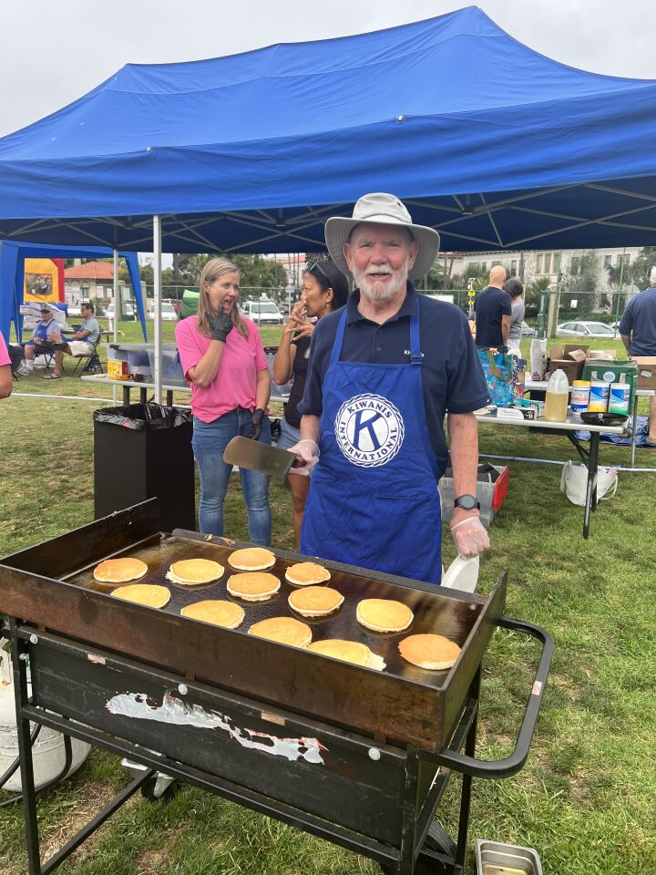 Kiwanis Club of La Jolla member Don Hodges shows his pancake-flipping skills.