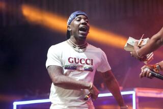 YFN Lucci in a white Gucci t-shirt performs onstage during the Hot 107.9 Birthday Bash 2019 at State Farm Arena in Atlanta