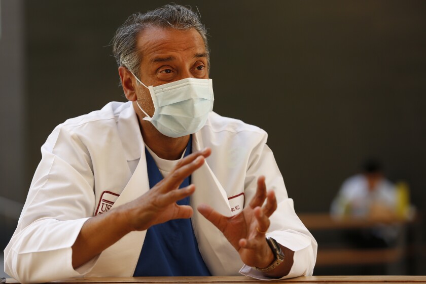 Column: Gasping, afraid, alone. What it's like to die a
COVID-19 death 2 For the first three weeks of the pandemic, Dr. Adupa Rao stayed in dorms at Keck.