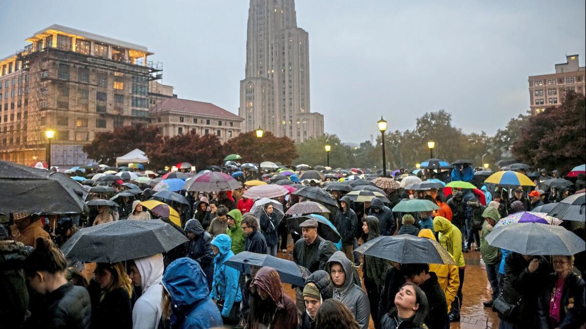 Mourners attend a vigil for the victims of the Tree of Life Synagogue mass shooting on Oct. 28 in the Squirrel Hill area of Pittsburgh.