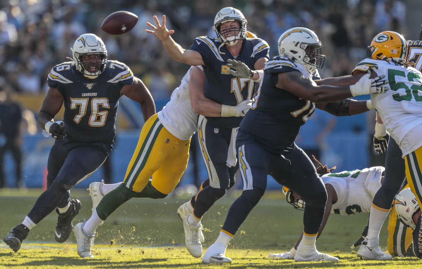 Chargers quarterback Philip Rivers flips the ball to running back Melvin Gordon.
