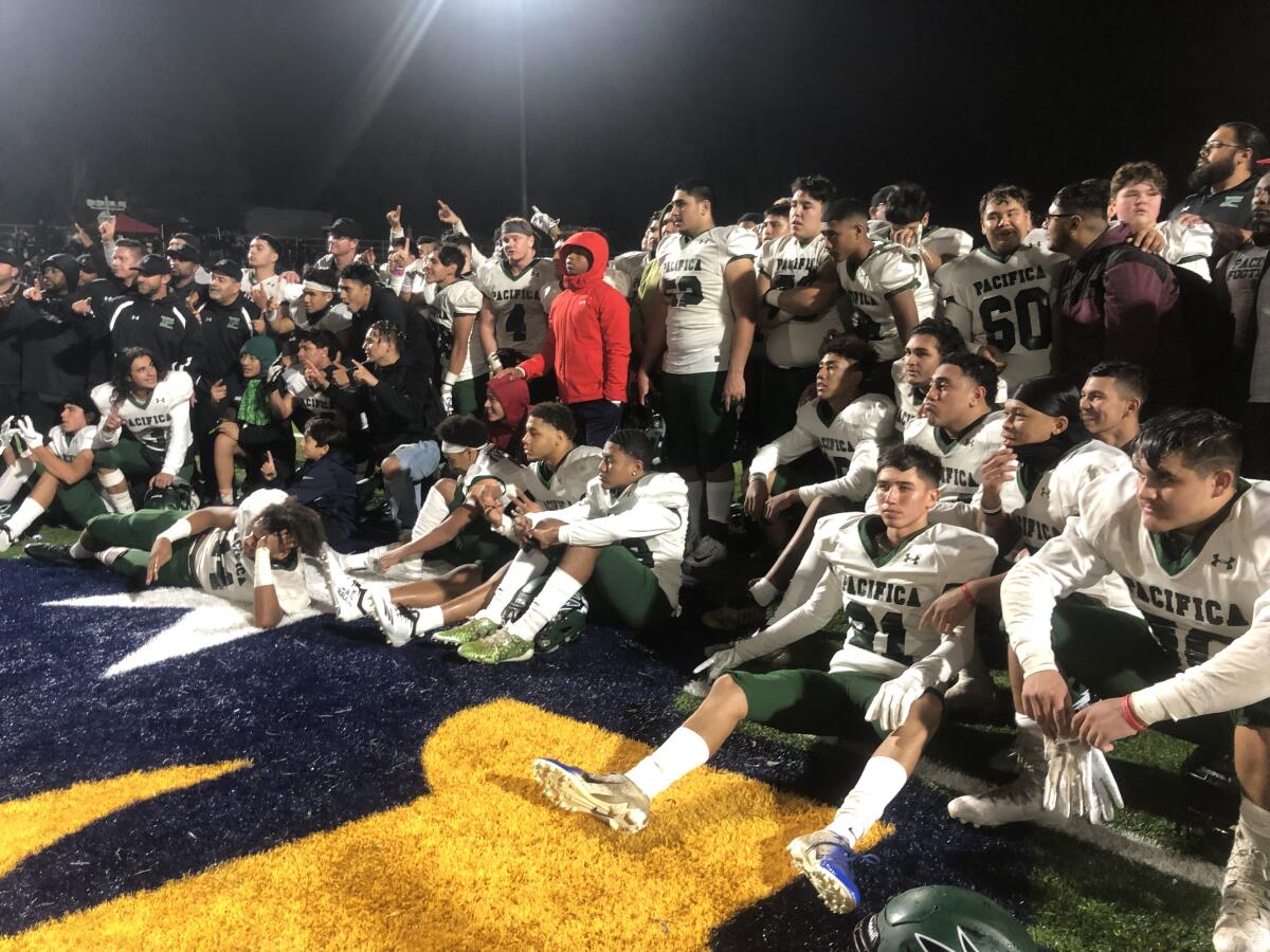 Oxnard Pacifica players celebrate their 2-A bowl victory over Birmingham on Dec. 7, 2019.