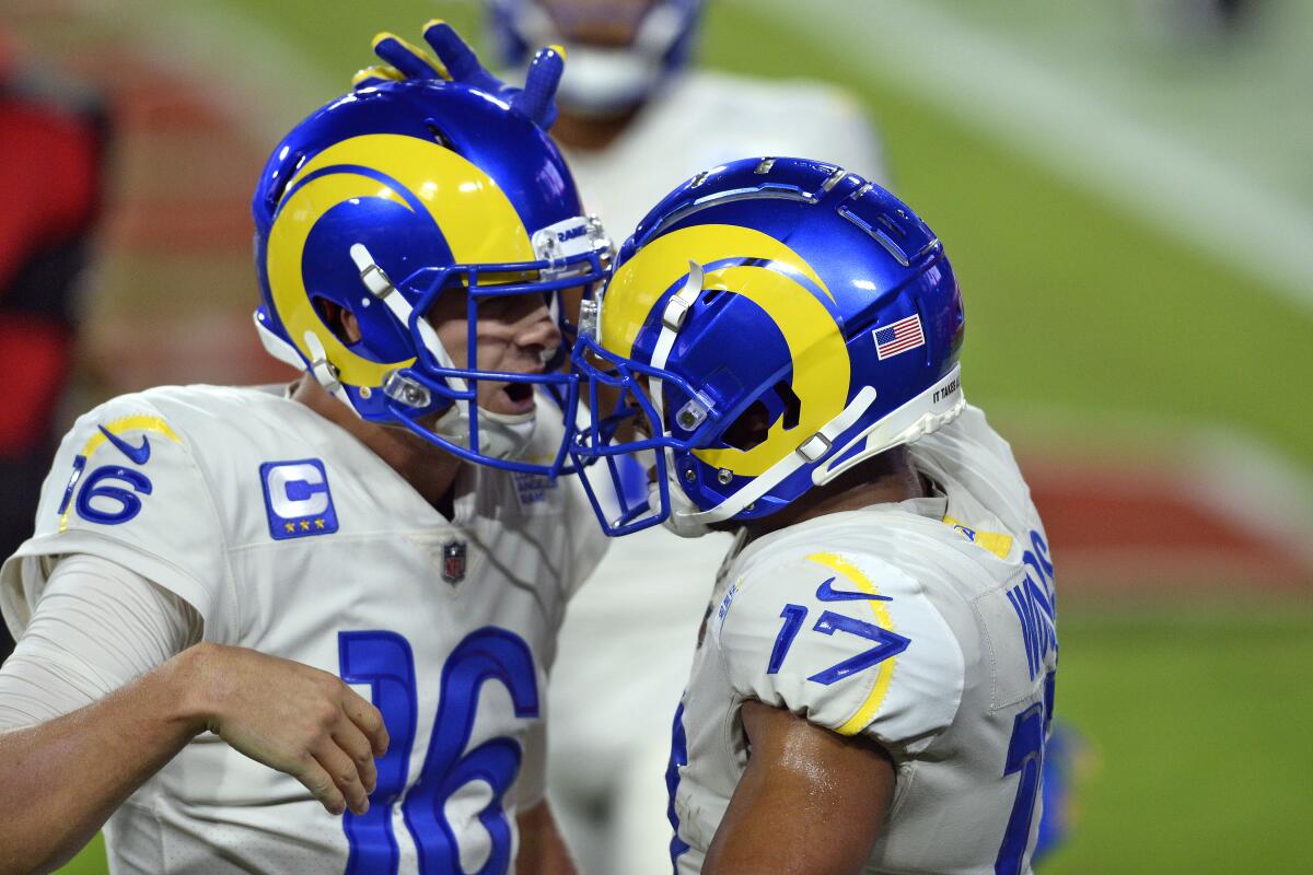 Rams wide receiver Robert Woods, right, celebrates with quarterback Jared Goff after catching a touchdown pass.