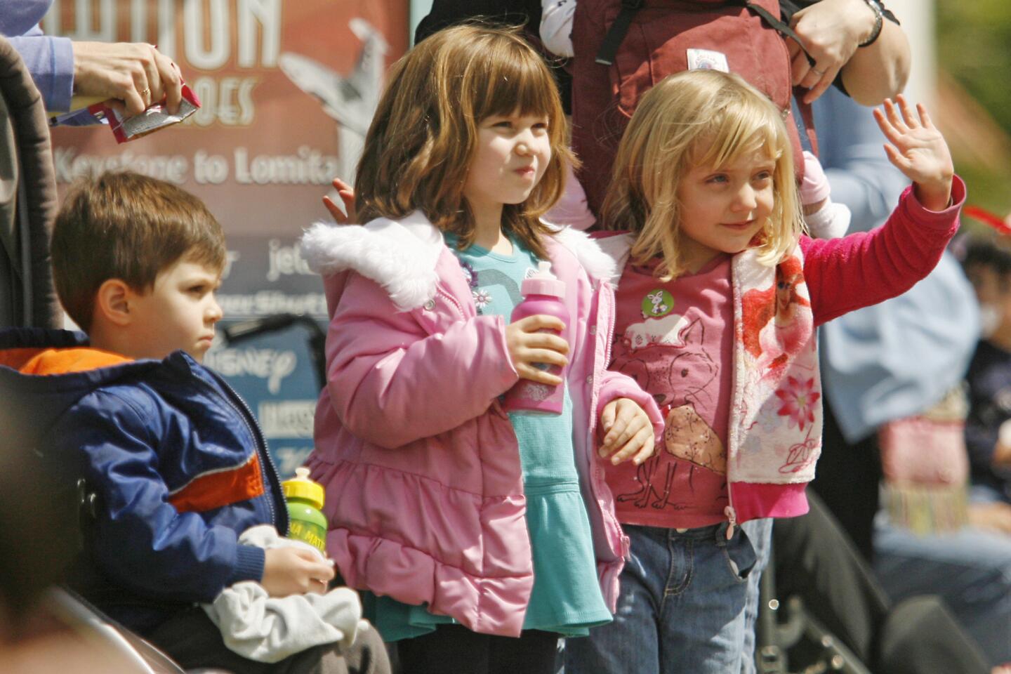 Niko Graft, 2, from left, Niko's sister, Ruby, 4, and Lily Werve, 4, wave to participants in Burbank on Parade, which took place on Olive Ave. between Keystone St. and Lomita St. on Saturday, April 14, 2012.