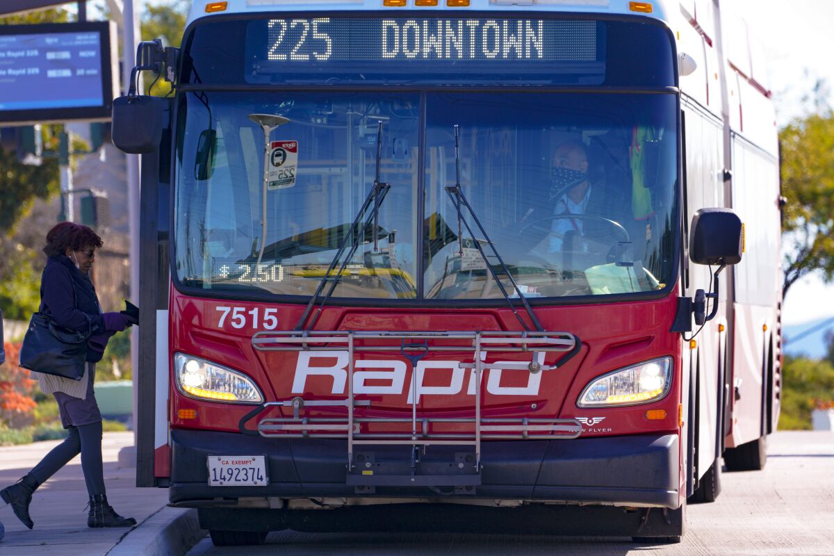 A passengers board the Rapid 225 bus on Thursday, Feb. 24, 2022 in Chula Vista.