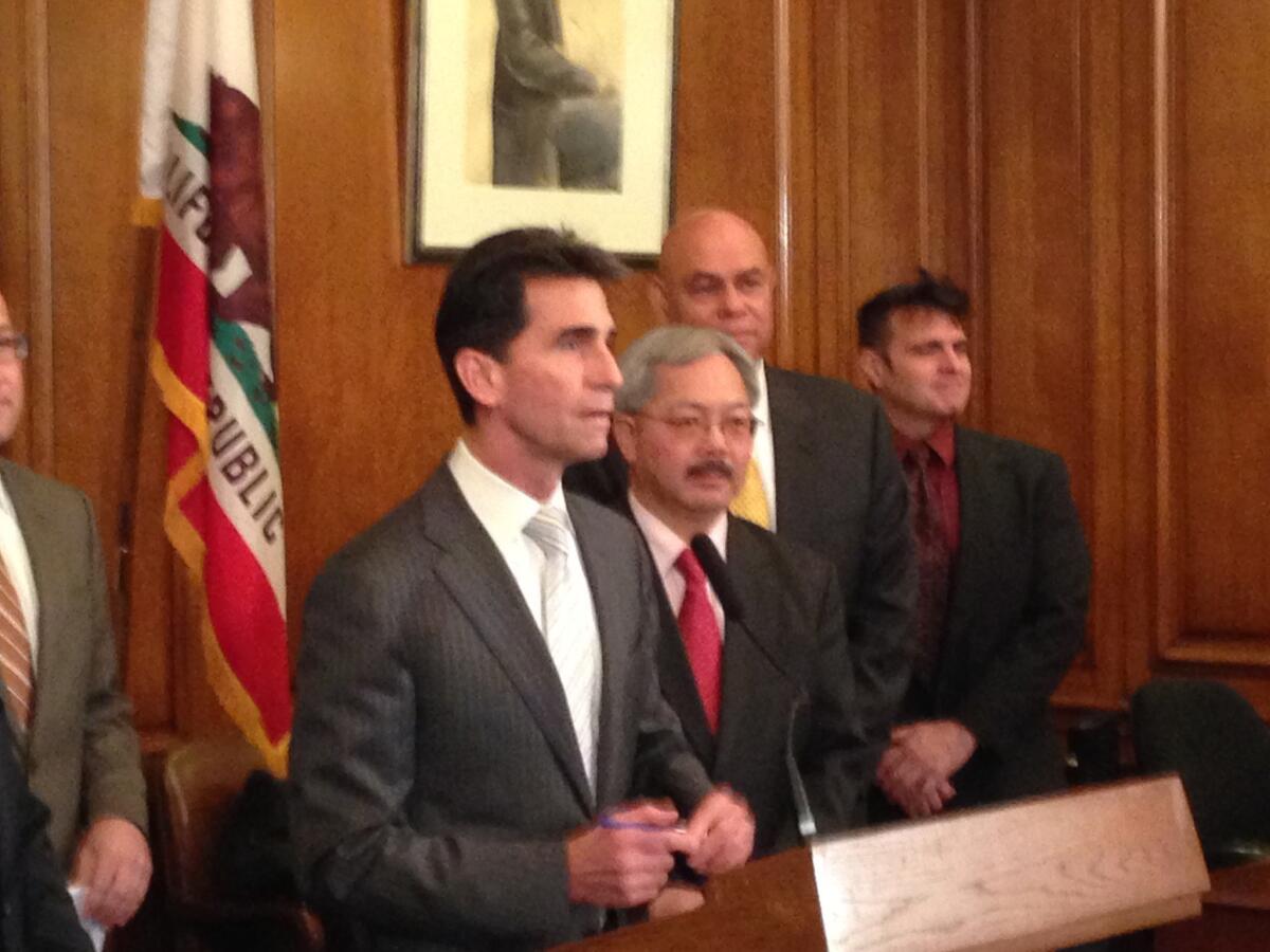 State Sen. Mark Leno stands with San Francisco Mayor Ed Lee to announce legislation that would guarantee funding levels for City College of San Francisco as it fights to regain accreditation. City College Chancellor Arthur Tyler stands behind Lee.