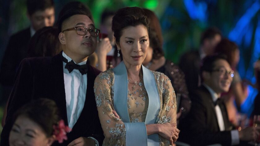 Michelle Yeoh and Nico Santos in a scene from "Crazy Rich Asians."