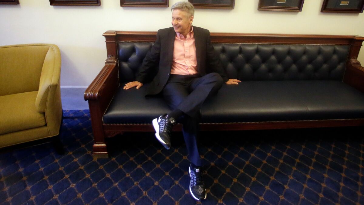 Former New Mexico Gov. Gary Johnson waits to speak with legislators at the Utah State Capitol in Salt Lake City on May 18.