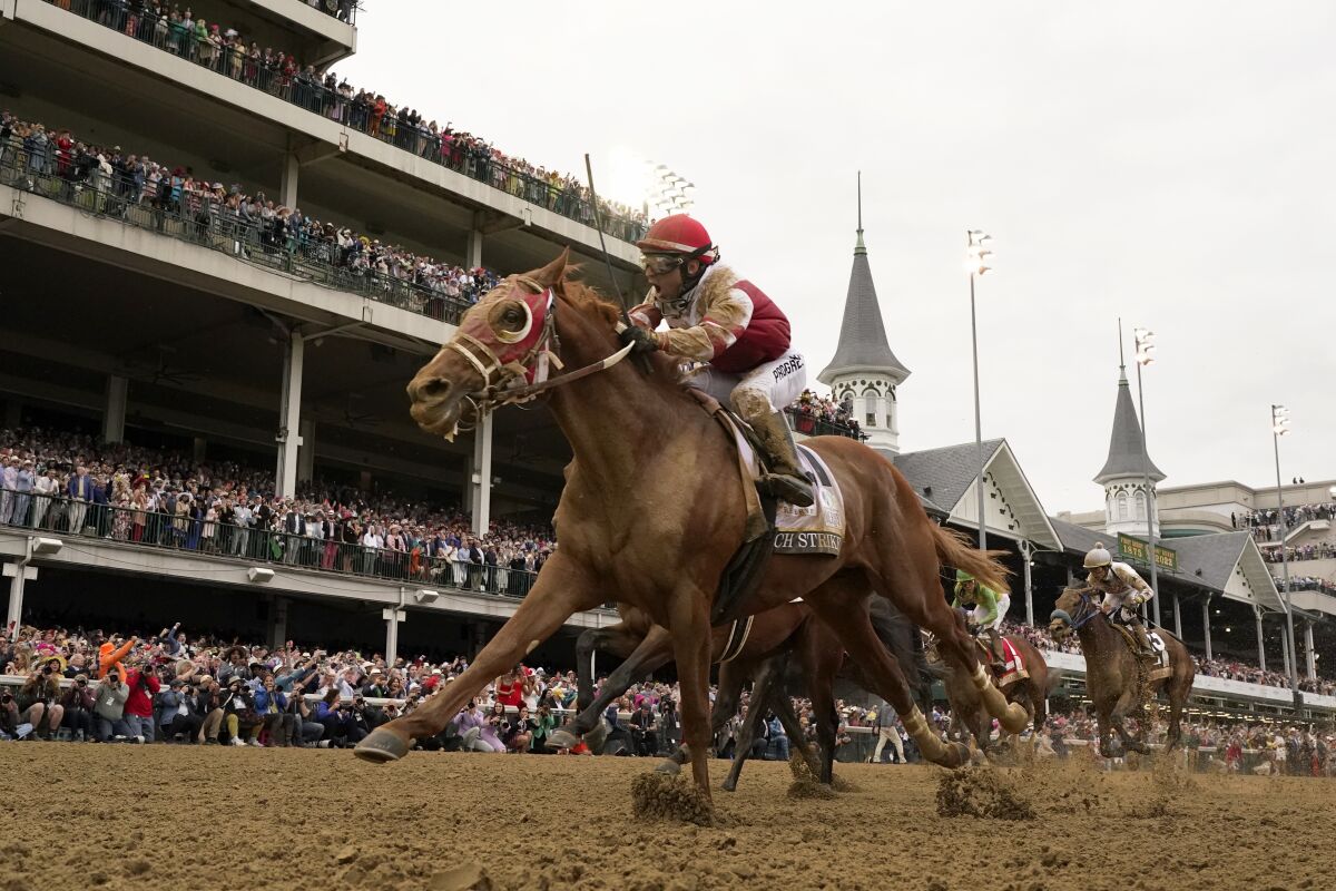Rich Strike, with Sonny Leon aboard, wins the 148th running of the Kentucky Derby.