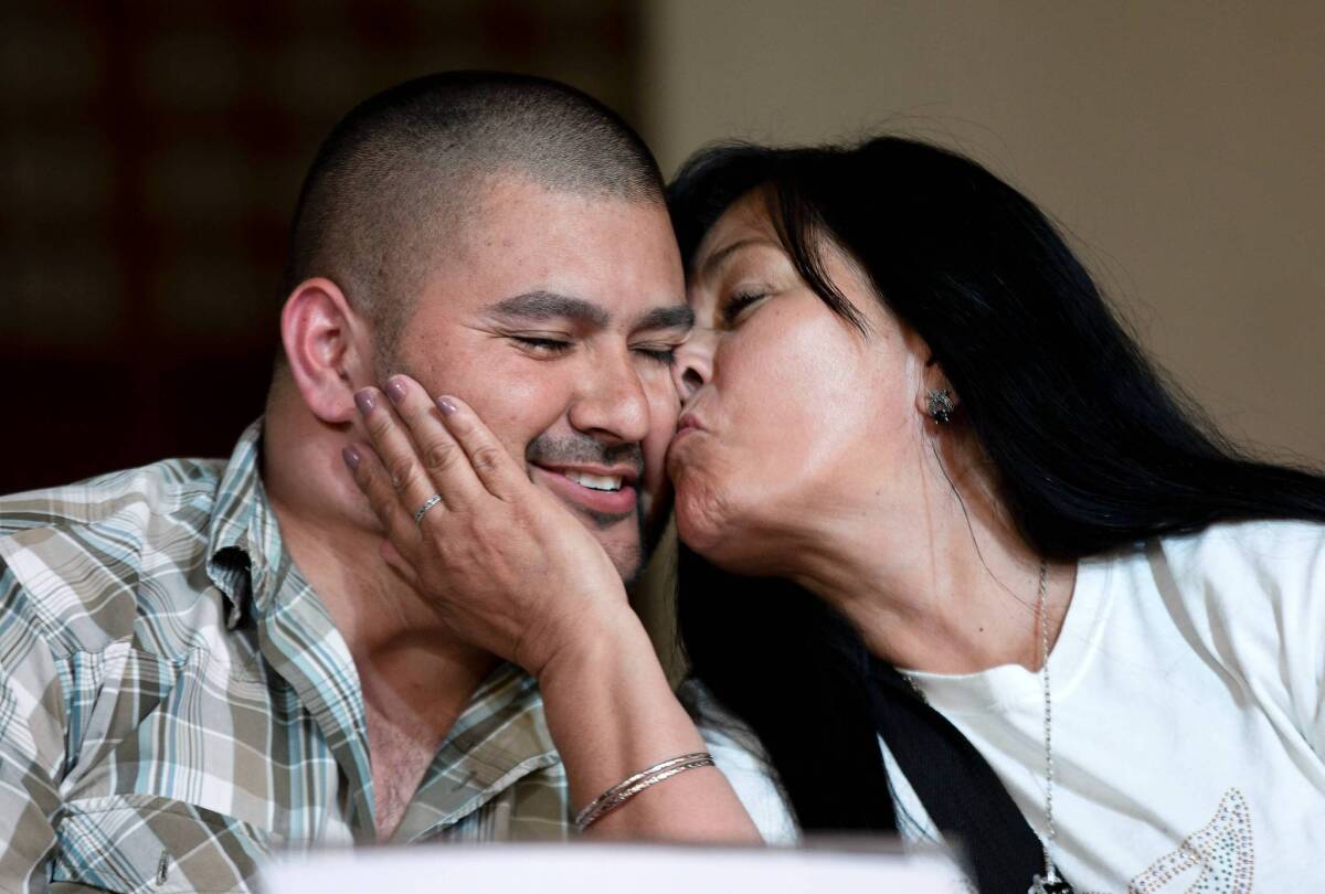 Guadalupe Melendez kisses her son Israel Arzate during a news conference in Mexico City last week after he was freed by the Mexican Supreme Court. Arzate says soldiers tortured him into confessing to a role in a 2010 massacre.