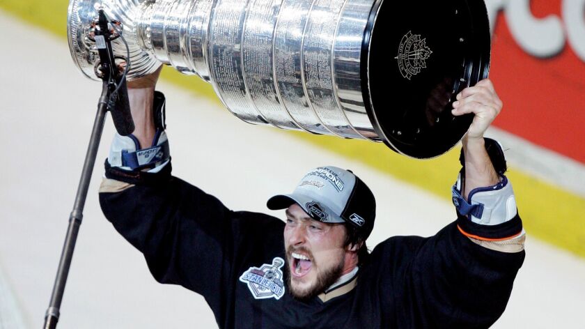 In this June 6, 2007, photo, the Ducks' Teemu Selanne raises the Stanley Cup.