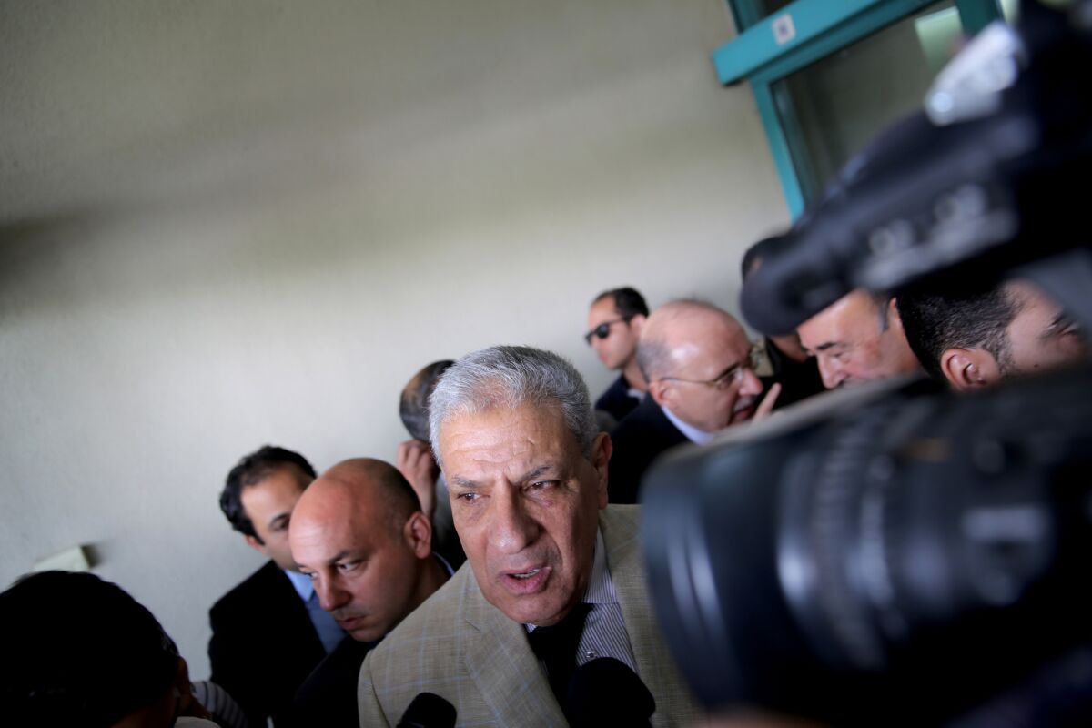 Acting Egyptian Prime Minister Ibrahim Mehleb speaks to journalists after visiting injured Mexican tourists at the Dar Al Fouad Hospital in Cairo on Monday.
