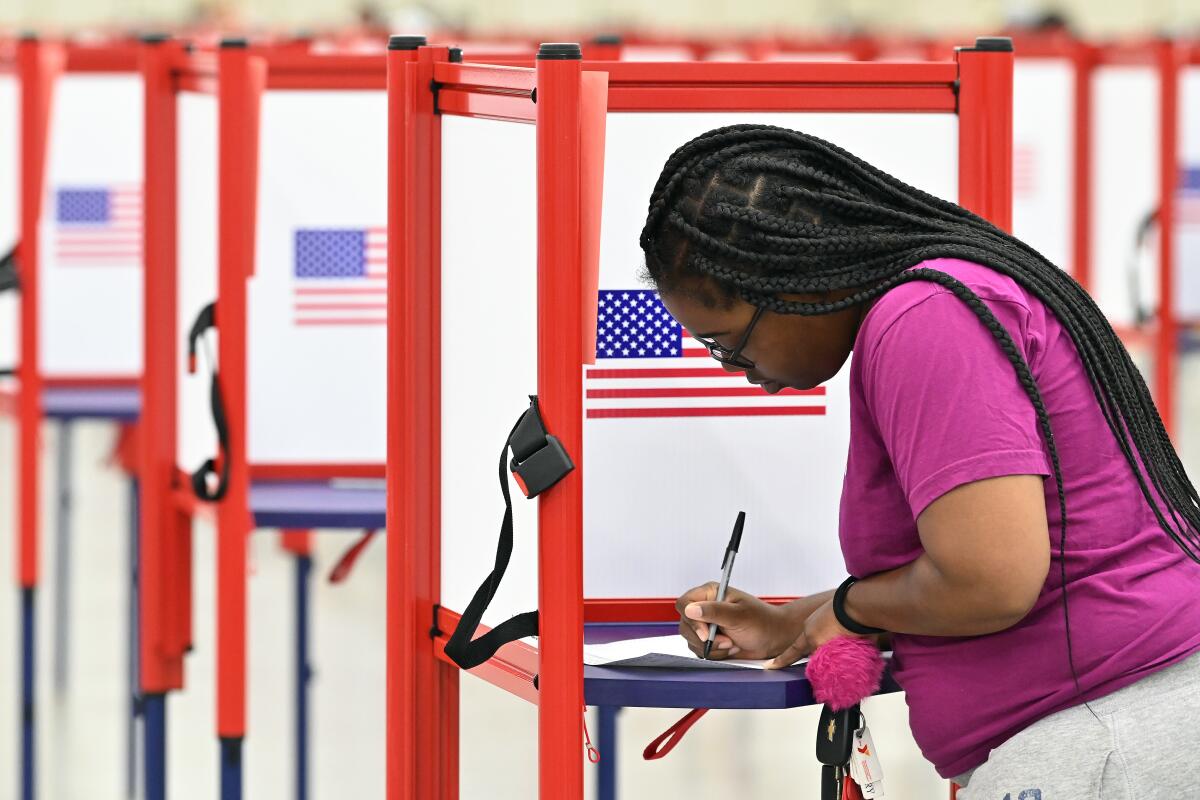 A voter fills out a  ballot in Louisville, Ky.