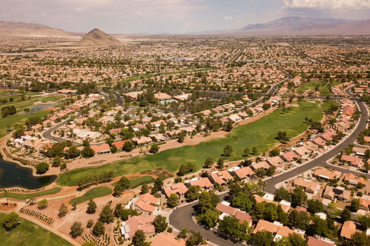 An aerial image shows homes and a golf course in Las Vegas.