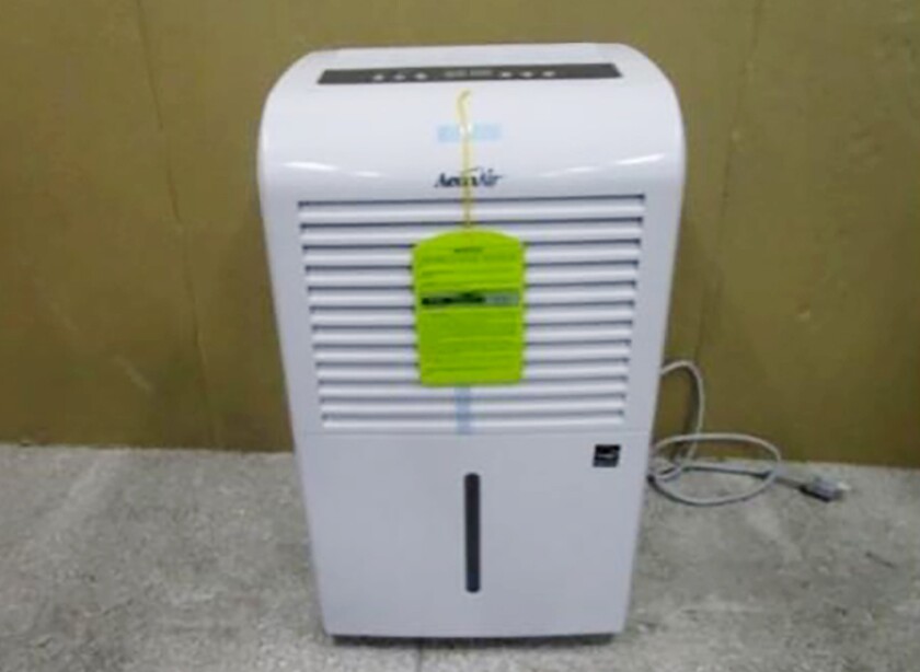 This photo provided by Consumer Product Safety Commission shows a dehumidifier made by New Widetech. The Consumer Product Safety Commission says, Friday, Aug. 6, 2021, about 2 million dehumidifiers made by New Widetech are being recalled in the U.S. because they can overheat and catch fire, posing fire and burn hazards. New Widetech is aware of 107 incidents of the recalled dehumidifiers overheating and/or catching fire, resulting in about $17 million in property damage. No injuries have been reported. (Consumer Product Safety Commission via AP)