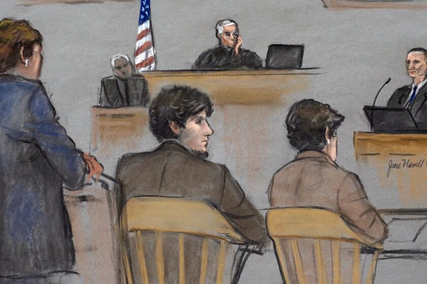 In this courtroom sketch, Bill Richard, right, testifies at the federal death penalty trial of Dzhokhar Tsarnaev, second from left, in Boston. Tsarnaev is between defense attorneys Judy Clarke, left, and Miriam Conrad and U.S. District Judge George O'Toole Jr. presides.