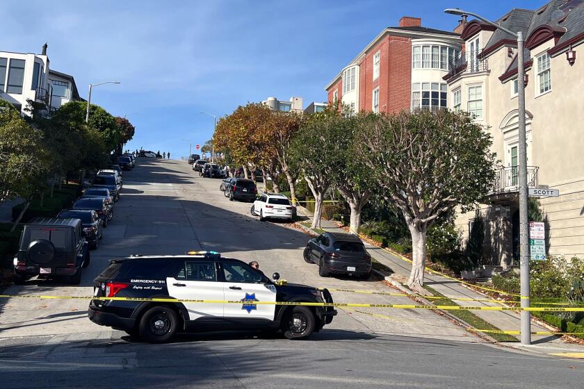 SAN FRANCISCO CA OCTOBER 28, 2022 - Police officers blocked the street outside the San Francisco home of U.S. House Speaker Nancy Pelosi and her husband Paul Pelosi on Friday, October 28, 2022. (Hannah Wiley / Los Angeles Times)