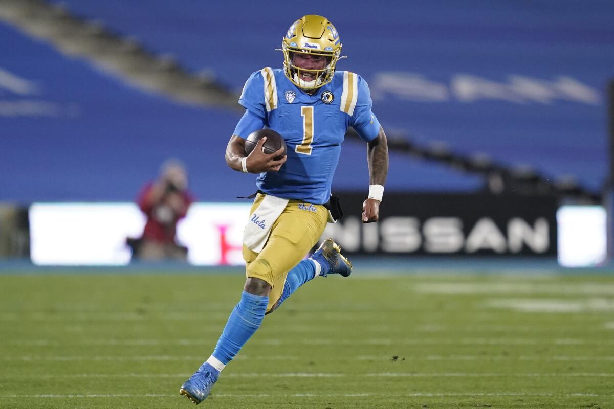 UCLA quarterback Dorian Thompson-Robinson (1) runs the ball during the second quarter Dec. 12, 2020.
