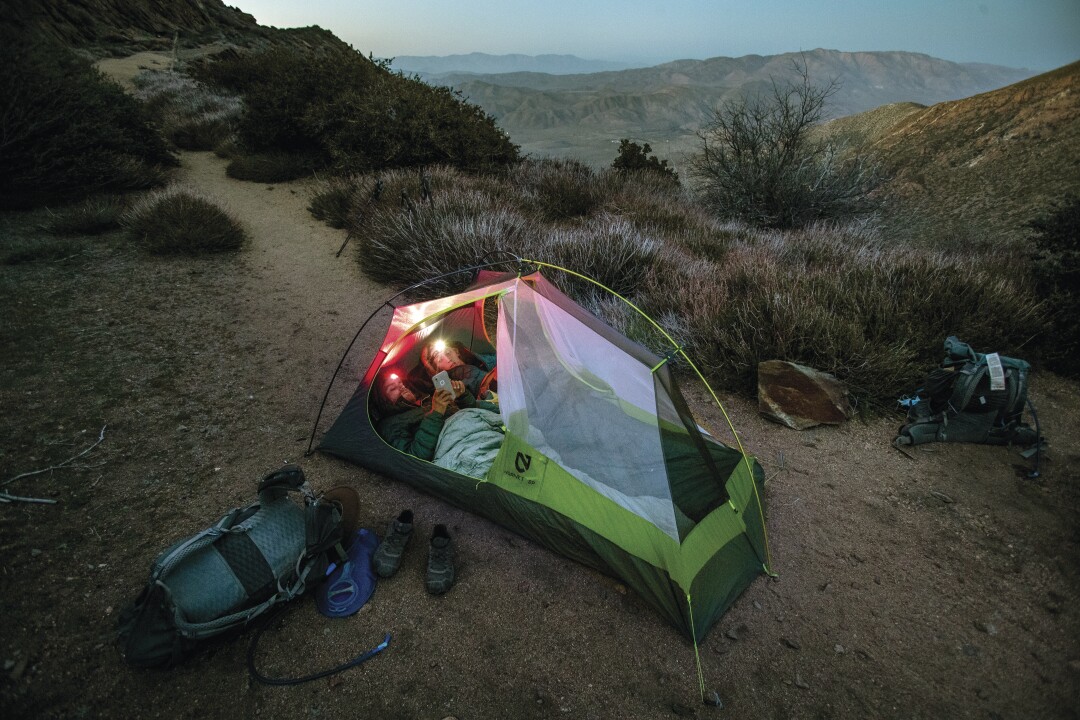 April 2: People in a tent along the Pacific Crest Trail.