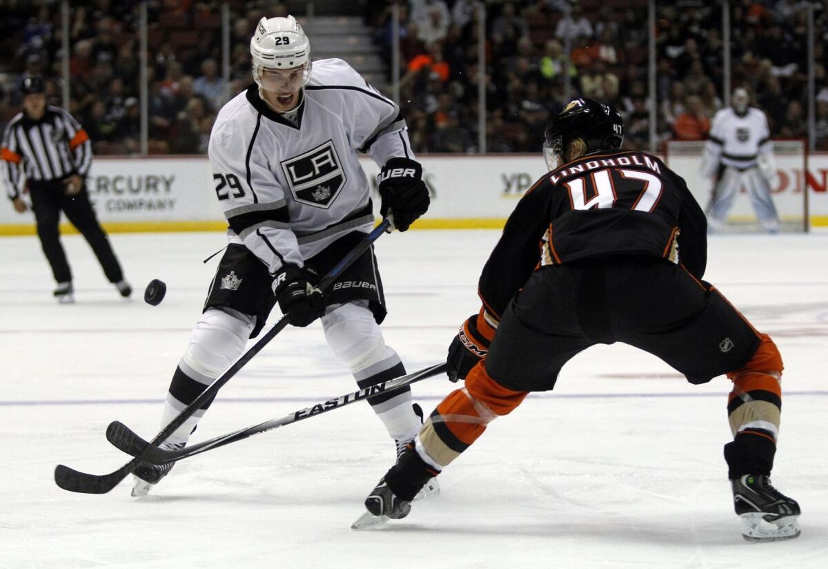 Ducks defenseman Hampus Lindholm defends against a shot by Kings right winger Adam Cracknell during the first period of an exhibition game Sunday.
