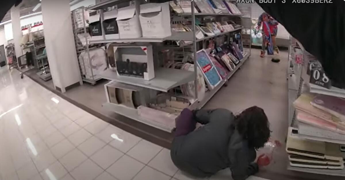 Victim on the floor and a suspected attacker in a store