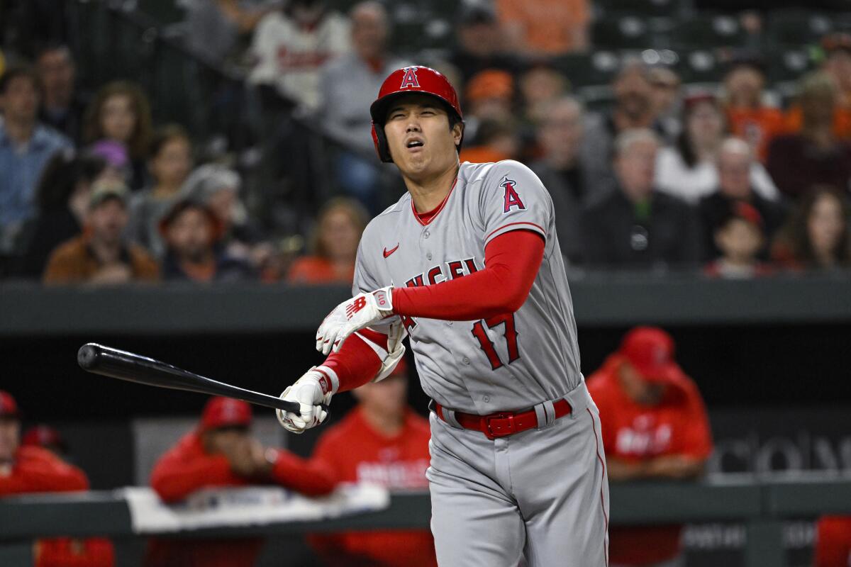 Angels star Shohei Ohtani reacts after swinging at a pitch.